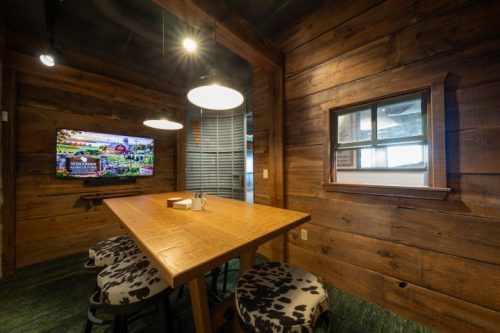 WCA enclosed room wood walls and small table