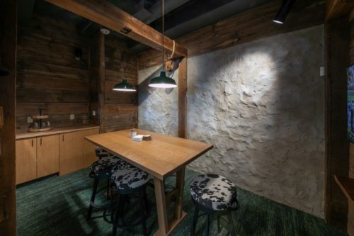WCA enclosed room wood walls and small table